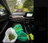 Woman peels green peas while waiting in Bengaluru traffic jam