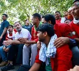 Congress Leader Rahul Gandhi wears red shirt and lifts luggage at railway station