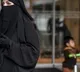 Swiss parliament approves ban on burqas sets fine for violators