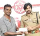 Tollywood stuntman Badri gives donation cheque to Pawan Kalyan