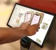 Affordable smartphone case provides workaround for inaccessible touch screens