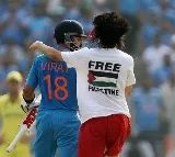 Pitch invader wearing 'Free Palestine' T-shirt hugs Kohli