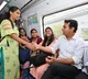 KTR interacts with people as he travels in Metro