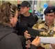 Shah Rukh patiently waits for police verification at Mumbai airport