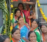 Man protest infront of bus to seats to men in buses