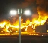 Japan Airlines plane catches fire at Tokyo airport; all 379 passengers, crew escape