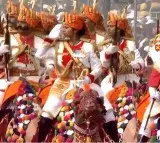Female riders on decorated camels participate in R-Day parade