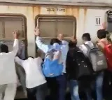 Passengers push Mumbai local train coach to save man