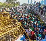 Amid massive security build-up, thousands of farmers head to Delhi