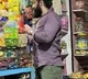 KGF sensation Yash Buys a candy for daughter in the road side shop