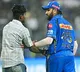 Fan who Enter into the Wankhede Stadium Ground and reach to Rohit Sharma during MI vs RR IPL 2024 Match