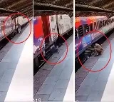 man slips trying to board moving train woman cop saves him