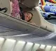 US Woman Climbs Into Overhead Bin Of Plane For Nap Internet Shocked
