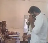 YCP candidate Duvvada Srinivas cast his vote while talking in mobile