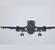 Passenger allegedly try to open running flight door