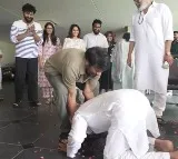 Pawan Kalyan touches Chiranjeevi feet
