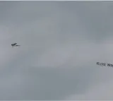 Plane carries banner Release Imran Khan flies over stadium while India and Pakistan match