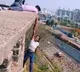 Pune Woman Hangs From Building Holding Mans Hand All For A Reel