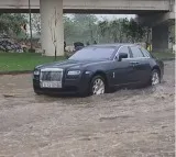 RollsRoyce Ghost breaks down on waterlogged road