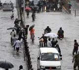 Heavy downpour leaves city waterlogged local train services hit