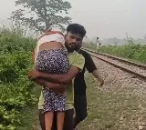Shattered Brother Carries Sisters Body On Shoulders After She Dies Due To Typhoid As No Medical Help Could Reach Her Due To Floods