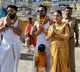 Devotees with heavy gold at Tirumala temple