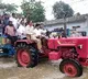 AP minister Kollu Ravindra drove tractor in flood hit areas in Vijayawada