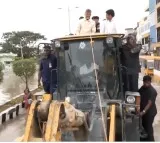 CM Chandrababu reached flood hit areas by JCB
