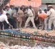 Andhra cops line up liquor bottles for disposal locals grab and run off