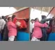 Coolie Hoists Passengers Into Train Coach Through Window