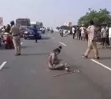 Aghori sit in protest at mangalagiri Highway