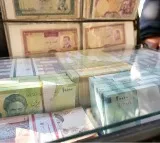 iran rial hits record low battered by regional tensions and energy crisis