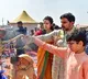 Minister Nara Lokesh and Brahmani Distribute Clothes to Brahmins at Kumbh Mela