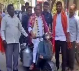 Former minister Malla Reddy ride scooter
