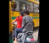 Woman Rides Helmetless With Parrot