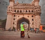 GHMC officer washes feets of sanitation worker