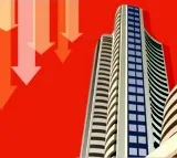 Stock market ends lower as investors take cautious approach on US tariffs