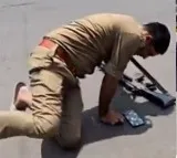 Drunk UP Police Constable Falls on Road with Gun Viral Video