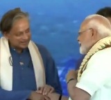 Modis Interesting Remarks with Tharoor by his side