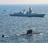 Indian Navy Shares Image of Warship Submarine and Helicopter