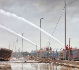 Iran revises port blast death toll to 57, arrests two over safety failures