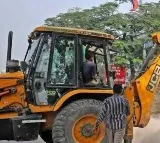 Moragudi villagers demolish accused Rahmatullas house