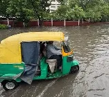 Delhi Rain Causes Flooding Flight Diversions