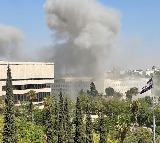 Syria military headquarters attacked by Israel news reader flees live