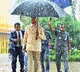 CM Chandrababu Carries His Own Umbrella in Rain