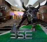 Sensex, Nifty trade flat after mild early losses; realty stocks gain