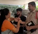 Home Minister Vangalapudi Anitha Ties Rakhi to Police Personnel