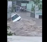 Adilabad Floods Car Washed Away in Adilabad Heavy Rains