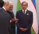 As PM Modi Putin walk past happily Shehbaz Sharif seen alone in a corner