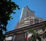 Stock Markets Close in Losses Amid Volatility